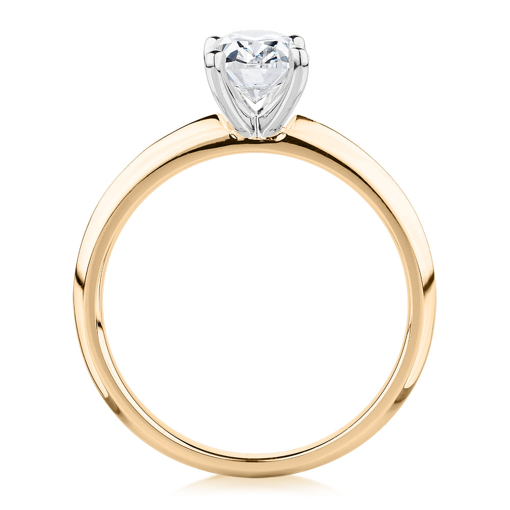 Oval solitaire engagement ring with 1.21 carat* diamond simulant in 14 carat yellow and white gold