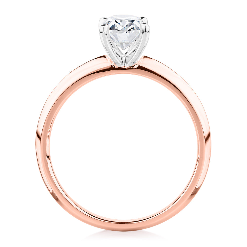 Oval solitaire engagement ring with 1.21 carat* diamond simulant in 14 carat rose and white gold