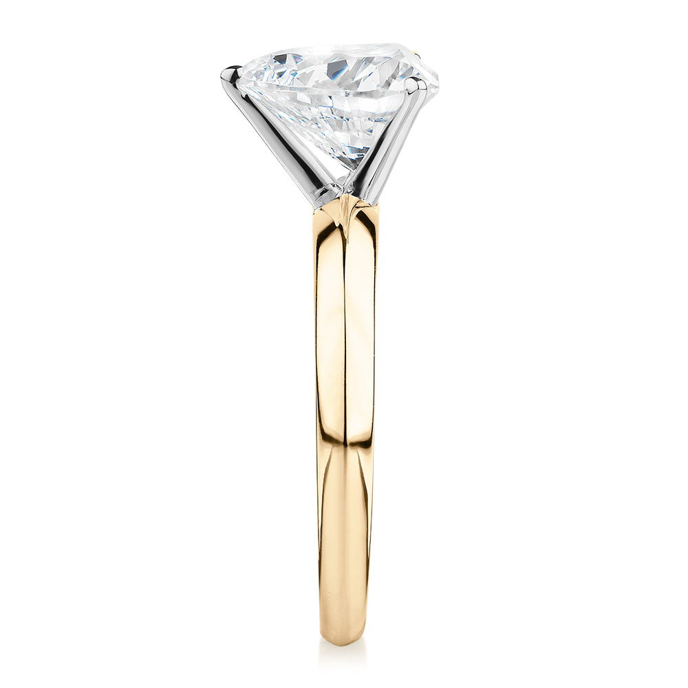 Heart solitaire engagement ring with 2.41 carat* diamond simulant in 14 carat yellow and white gold