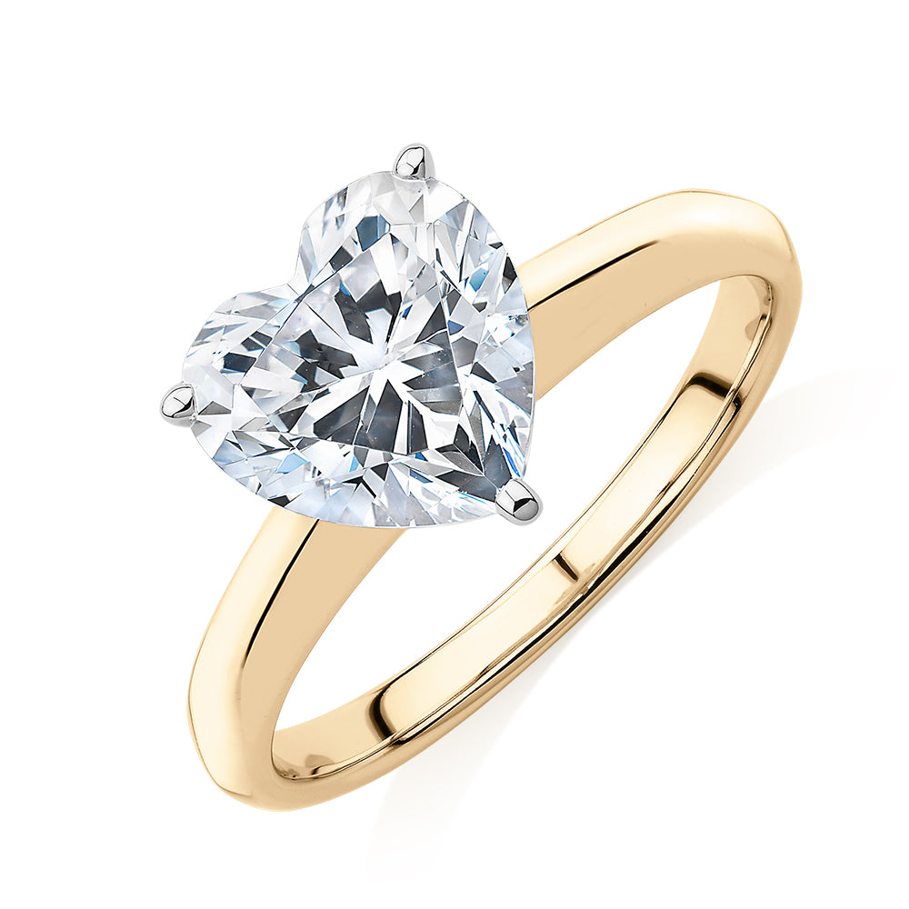 Heart solitaire engagement ring with 2.41 carat* diamond simulant in 14 carat yellow and white gold