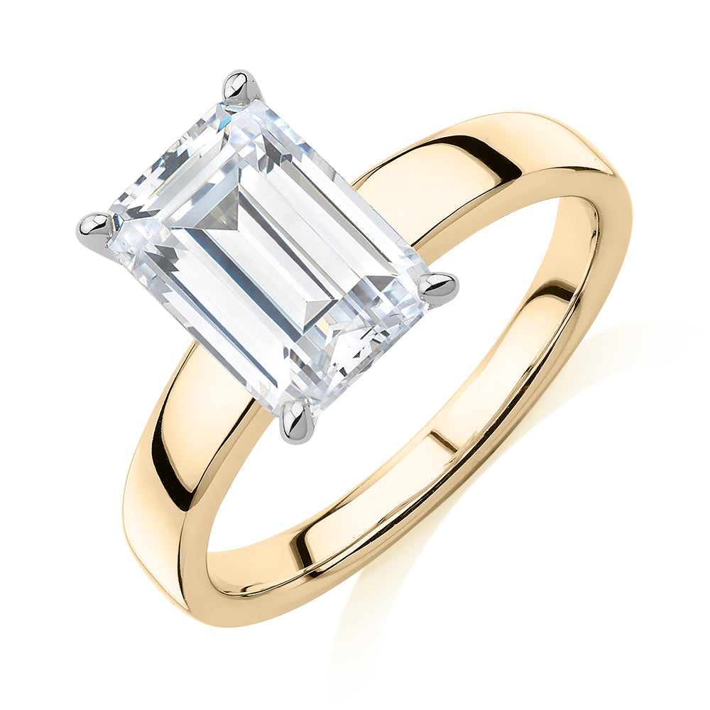 Emerald Cut solitaire engagement ring with 3.01 carat* diamond simulant in 14 carat yellow and white gold