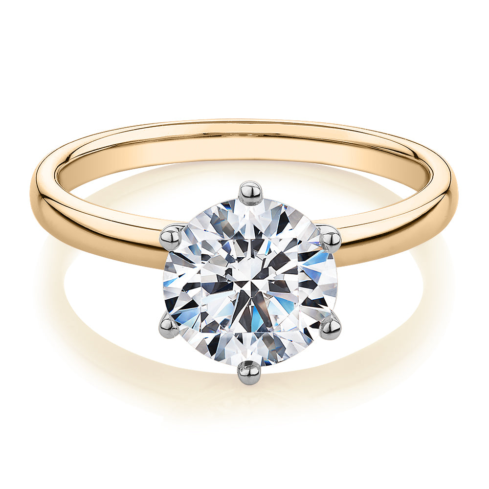 Round Brilliant solitaire engagement ring with carat* diamond simulant in 14 carat yellow and white gold