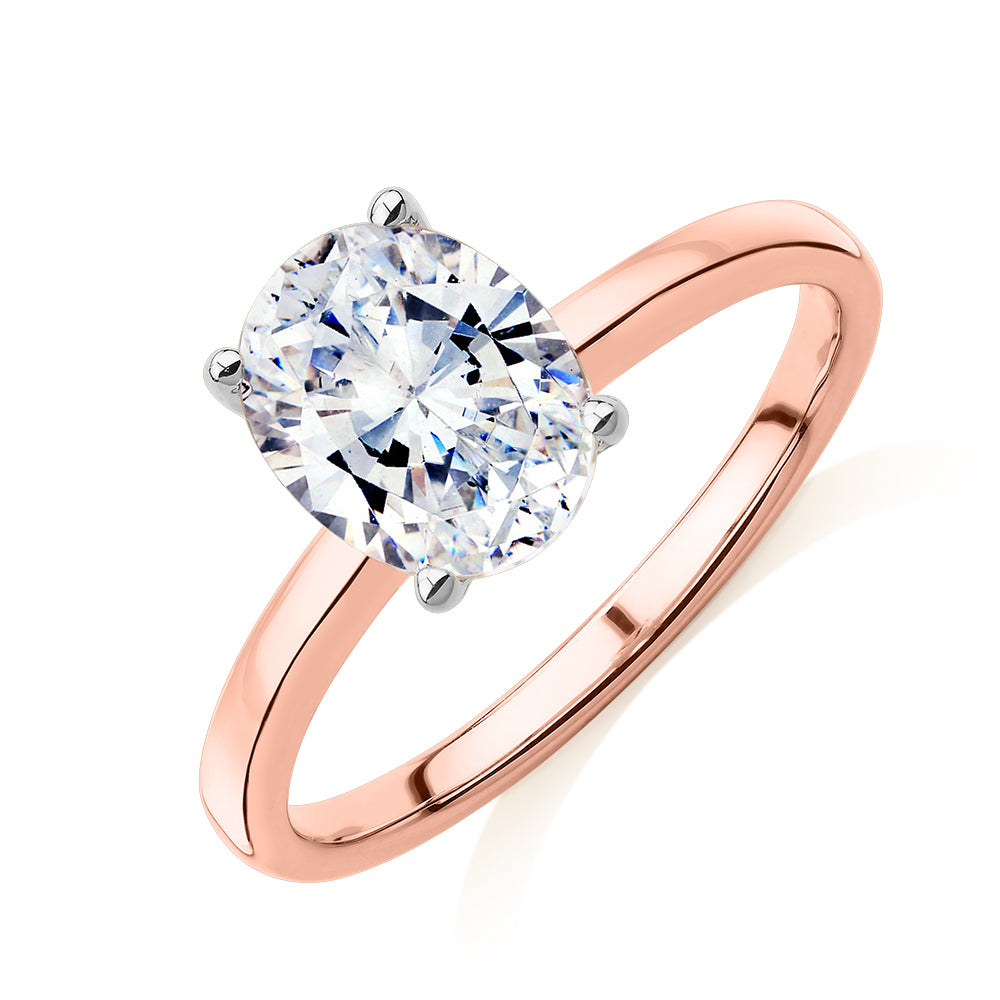 Oval solitaire engagement ring with 1.86 carat* diamond simulant in 14 carat rose gold