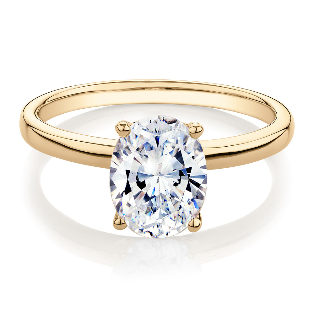Oval solitaire engagement ring with 1.86 carat* diamond simulant in 14 carat yellow gold