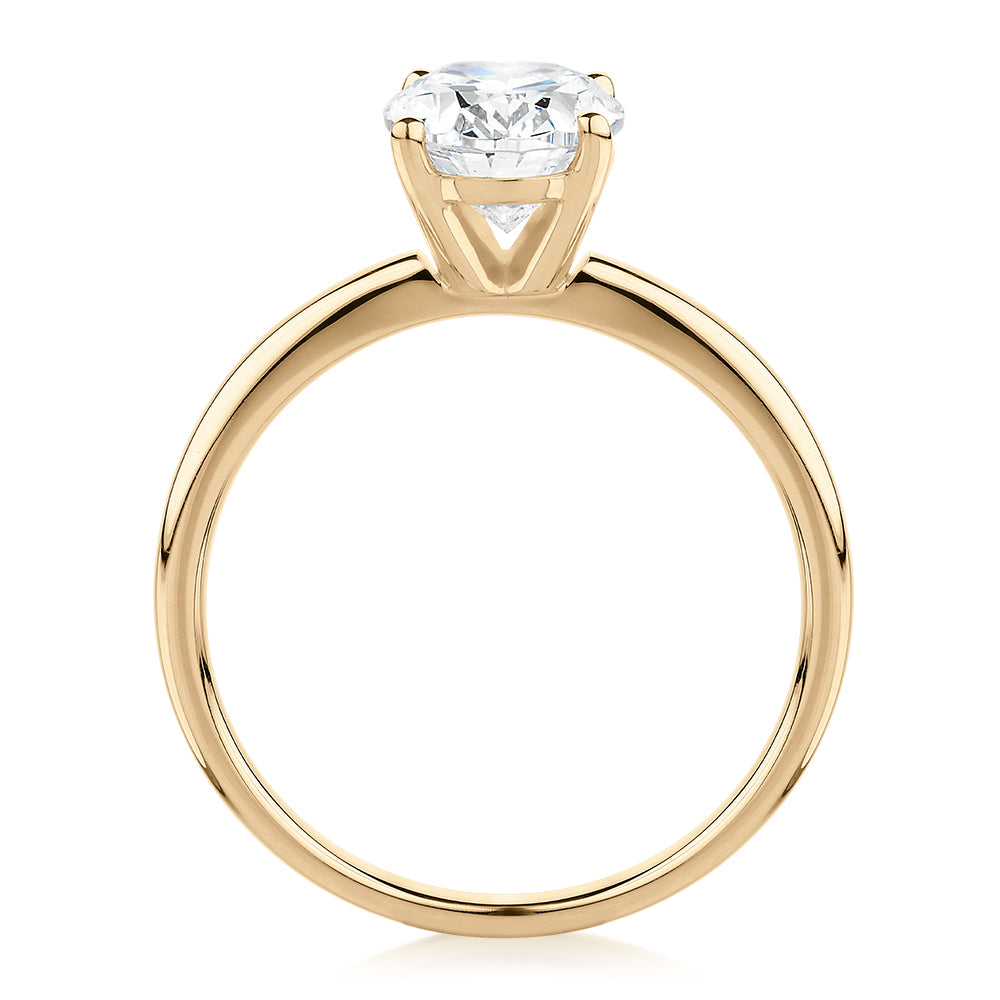 Oval solitaire engagement ring with 1.86 carat* diamond simulant in 14 carat yellow gold