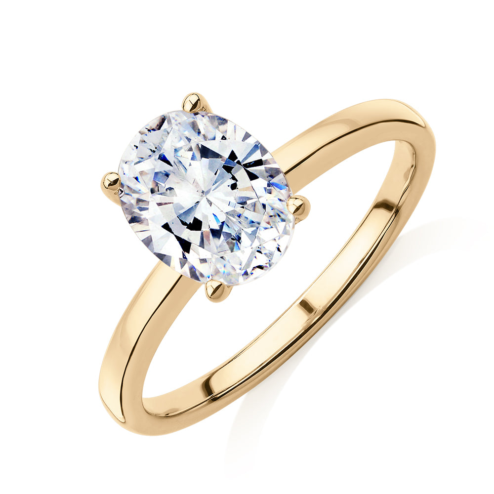 Oval solitaire engagement ring with 1.86 carat* diamond simulant in 14 carat yellow gold