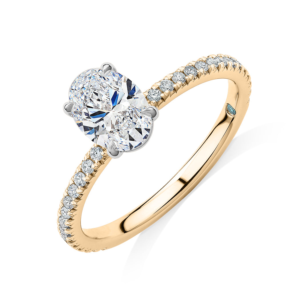 Premium Certified Lab-Grown Diamond, 1.24 carat TW oval and round brilliant shouldered engagement ring in 14 carat yellow and white gold