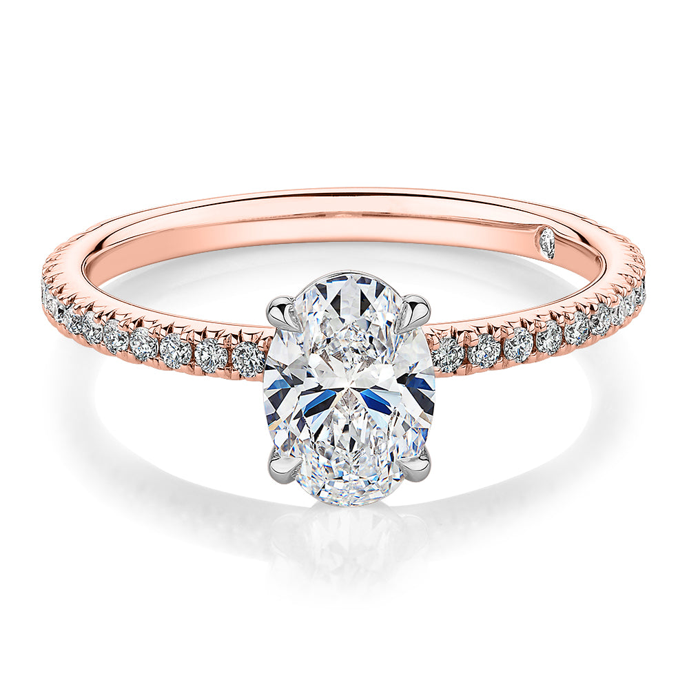 Signature Simulant Diamond 1.24 carat* TW oval and round brilliant shouldered engagement ring in 14 carat rose and white gold
