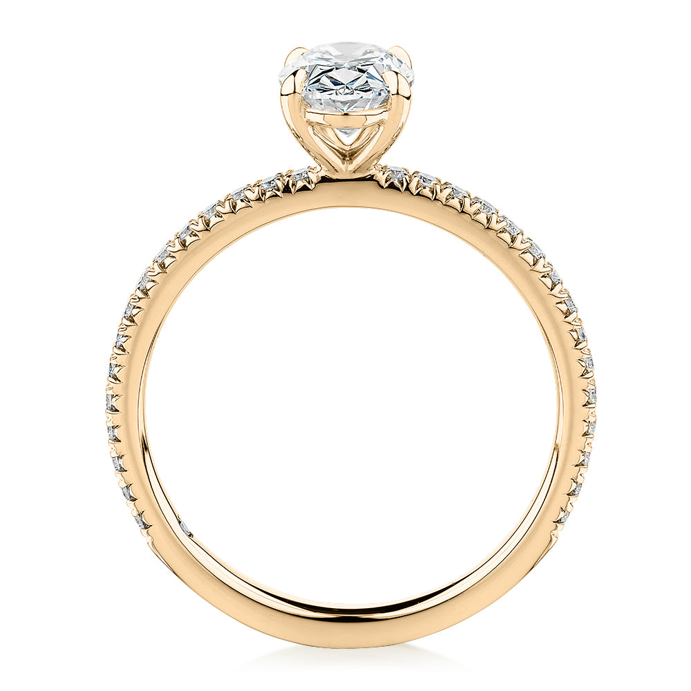 Signature Simulant Diamond 1.24 carat* TW oval and round brilliant shouldered engagement ring in 14 carat yellow gold