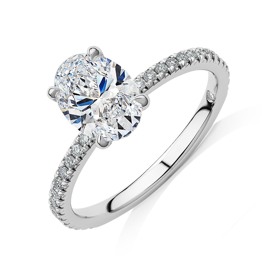 Signature Simulant Diamond 1.74 carat* TW oval and round brilliant shouldered engagement ring in 14 carat white gold