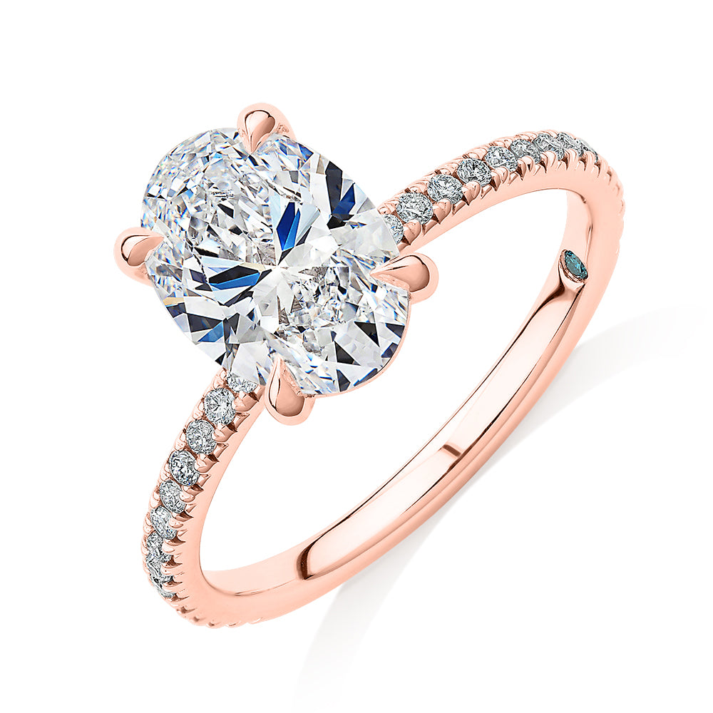 Premium Certified Laboratory Created Diamond, 2.24 carat TW oval and round brilliant shouldered engagement ring in 18 carat rose gold