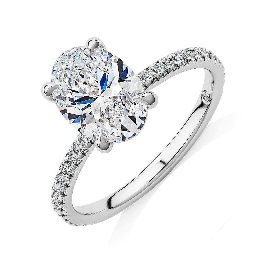Signature Simulant Diamond 2.19 carat* TW oval cut shouldered engagement ring in 14 carat white gold