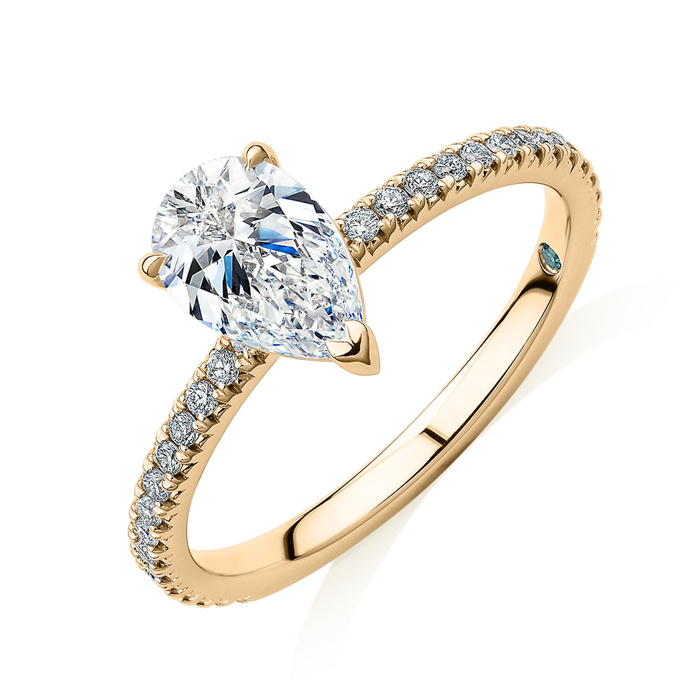 Premium Certified Laboratory Created Diamond, 1.24 carat TW pear and round brilliant shouldered engagement ring in 18 carat yellow gold