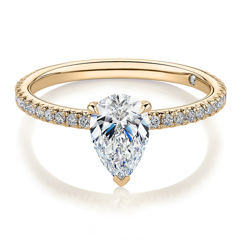 Signature Simulant Diamond 1.24 carat* TW pear and round brilliant shouldered engagement ring in 14 carat yellow gold
