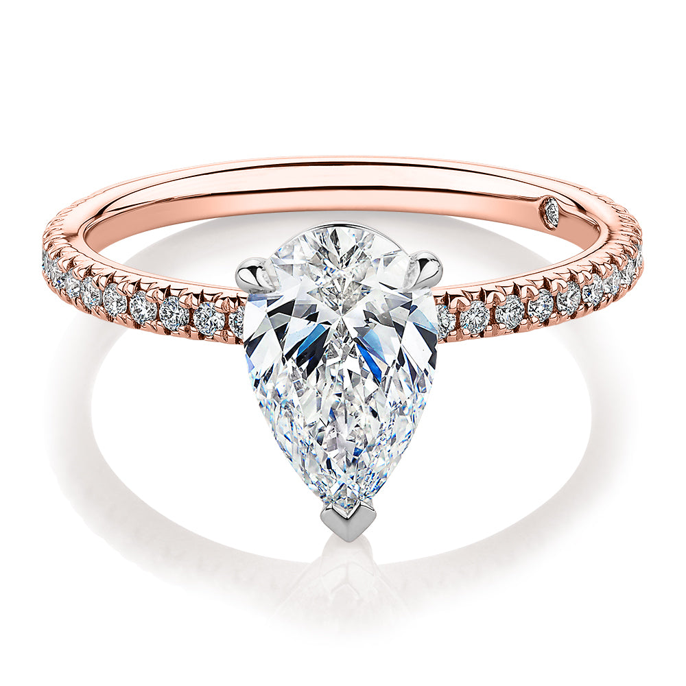 Signature Simulant Diamond 1.74 carat* TW pear and round brilliant shouldered engagement ring in 14 carat rose and white gold