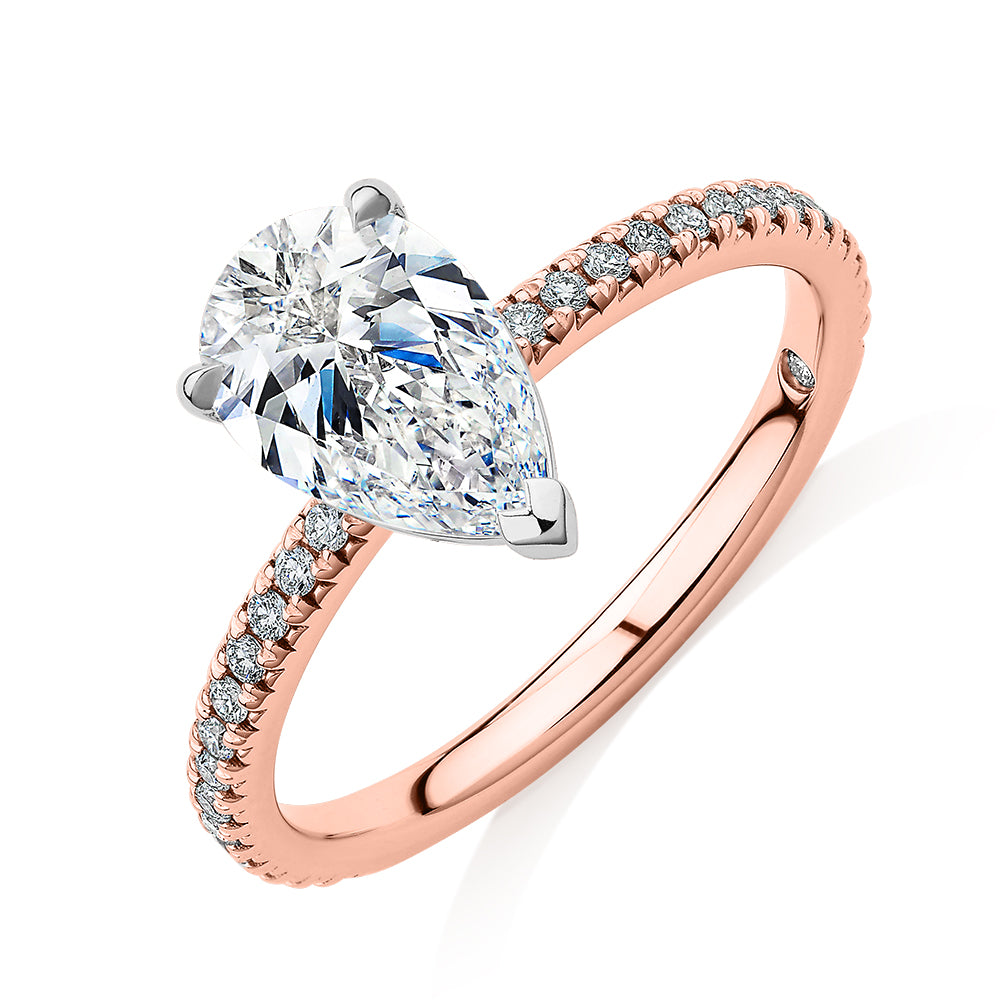 Signature Simulant Diamond 1.74 carat* TW pear and round brilliant shouldered engagement ring in 14 carat rose and white gold