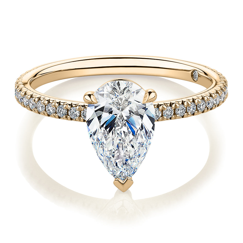 Signature Simulant Diamond 1.74 carat* TW pear and round brilliant shouldered engagement ring in 14 carat yellow gold