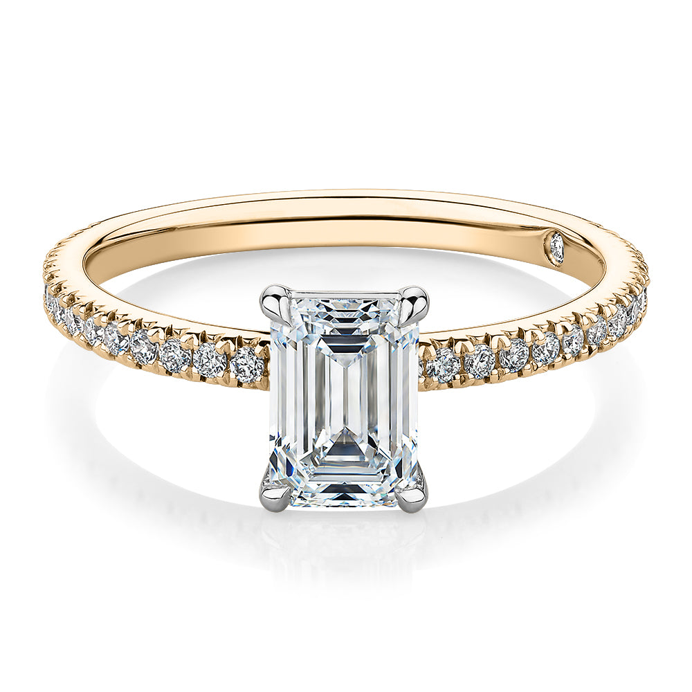 Signature Simulant Diamond 1.24 carat* TW emerald cut and round brilliant shouldered engagement ring in 14 carat yellow and white gold