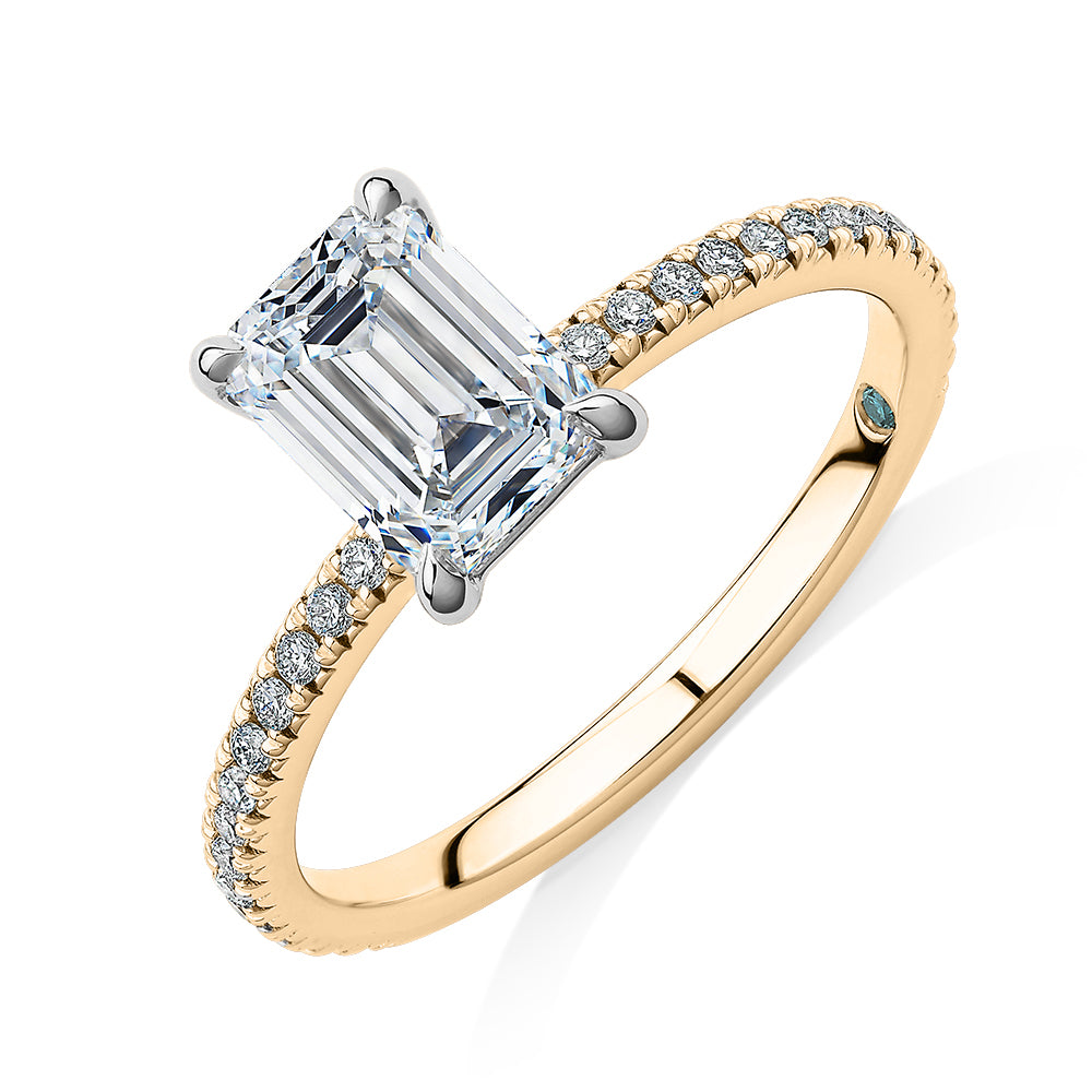 Premium Certified Laboratory Created Diamond, 1.74 carat TW emerald cut and round brilliant shouldered engagement ring in 18 carat yellow and white gold