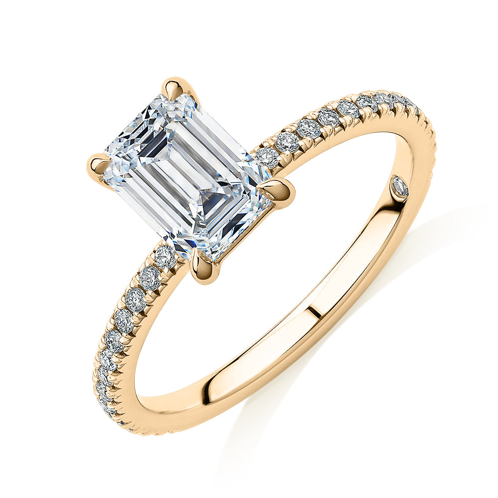 Signature Simulant Diamond 1.74 carat* TW emerald cut and round brilliant shouldered engagement ring in 14 carat yellow gold