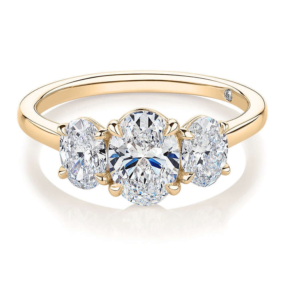 Signature Simulant Diamond 1.87 carat* TW oval three stone ring in 14 carat yellow gold