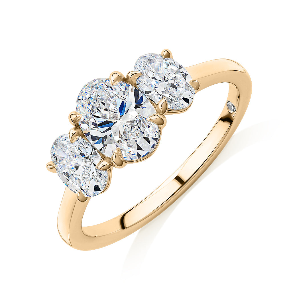 Signature Simulant Diamond 1.87 carat* TW oval three stone ring in 14 carat yellow gold