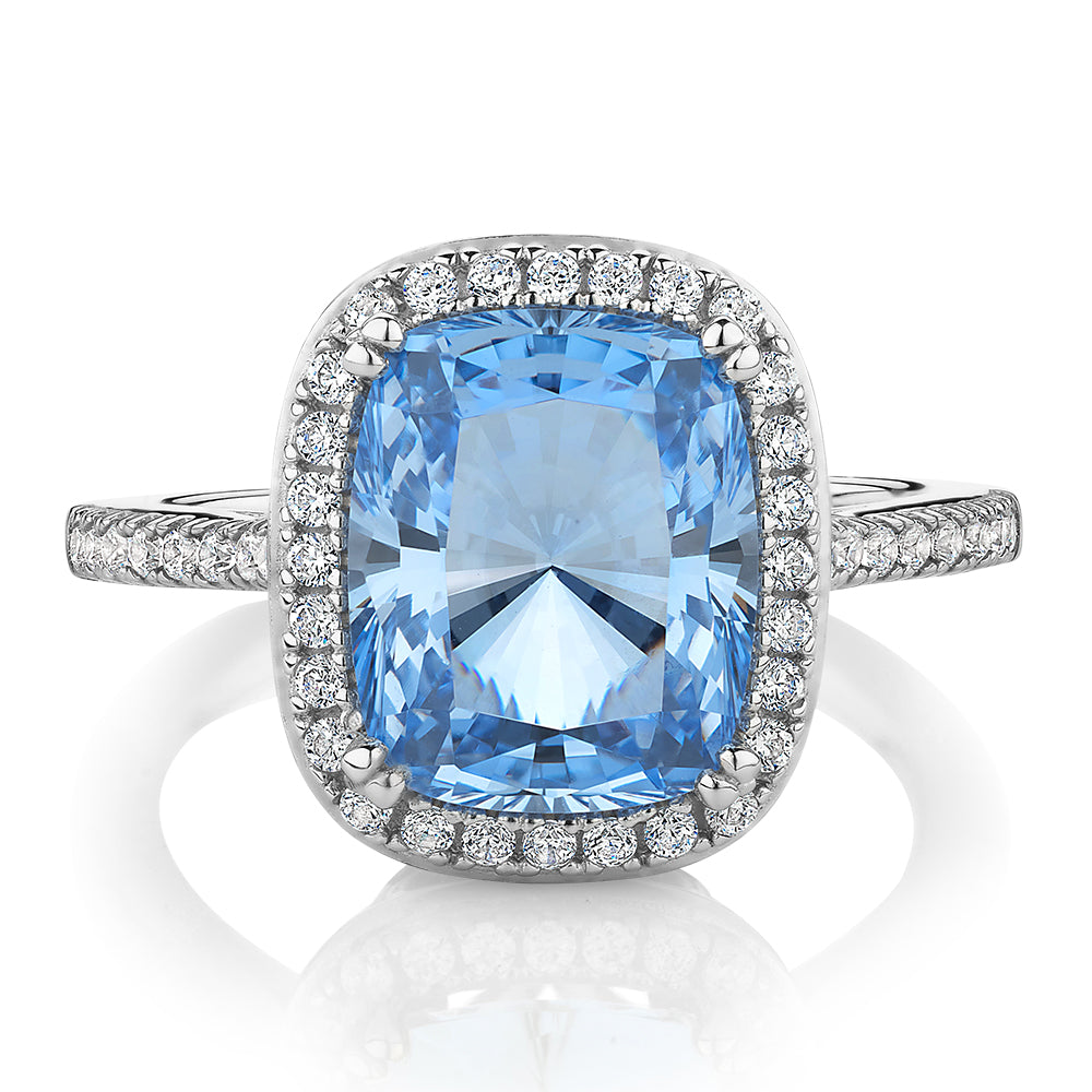 Dress ring with blue topaz simulant and 0.3 carats* of diamond simulants in sterling silver