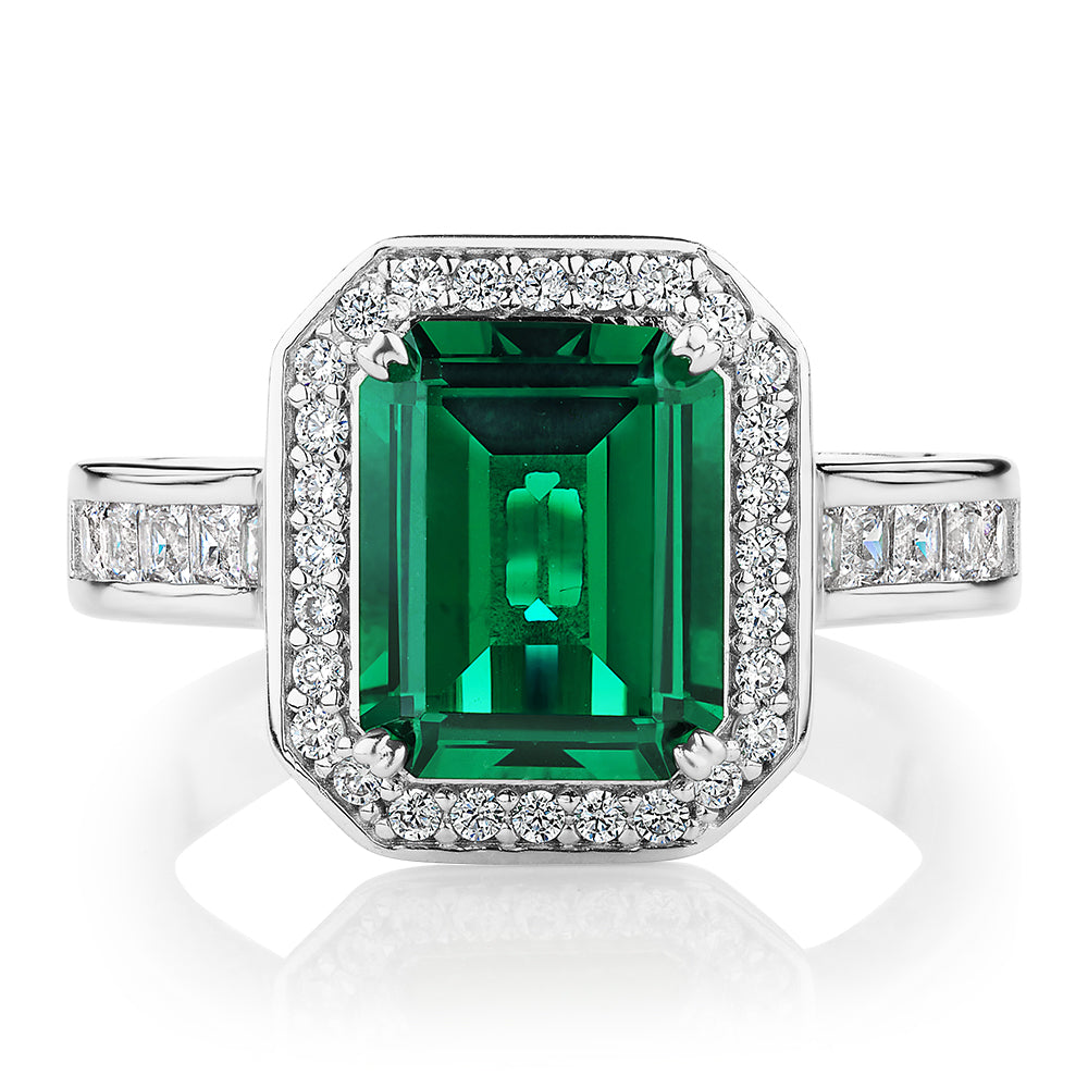 Dress ring with emerald simulant and 0.78 carats* of diamond simulants in sterling silver