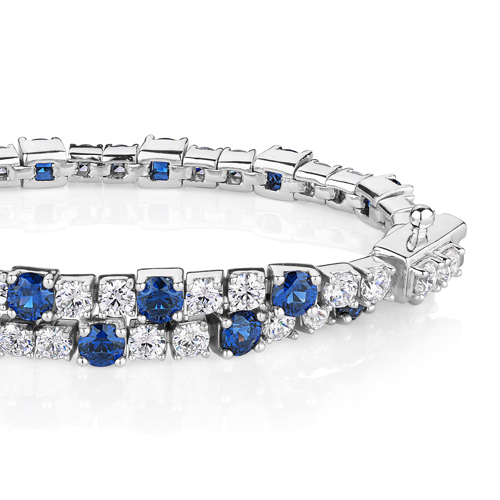 Round Brilliant tennis bracelet with sapphire simulants and 3.28 carats* of diamond simulants in sterling silver