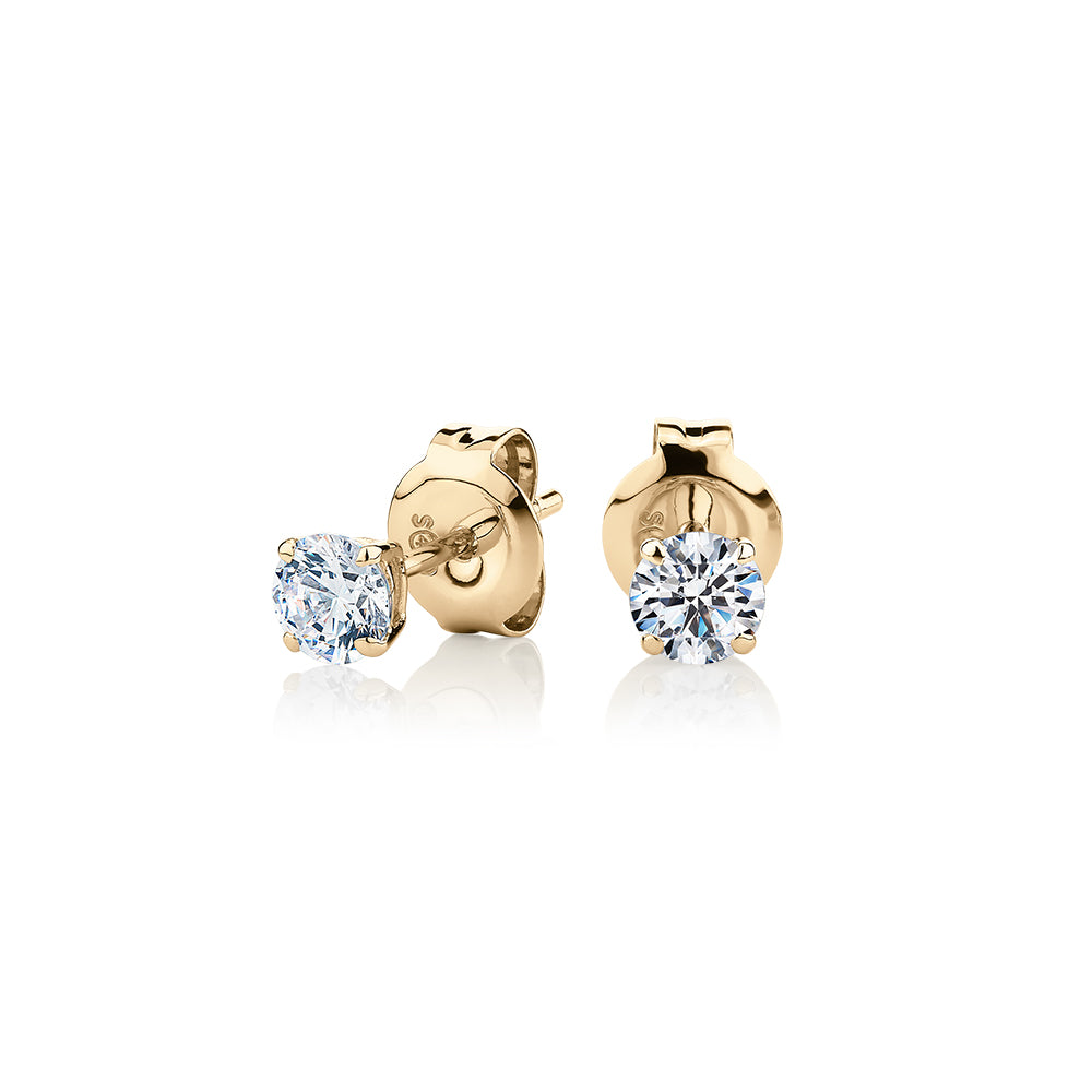 Round Brilliant stud earrings with 0.5 carats* of diamond simulants in 10 carat yellow gold