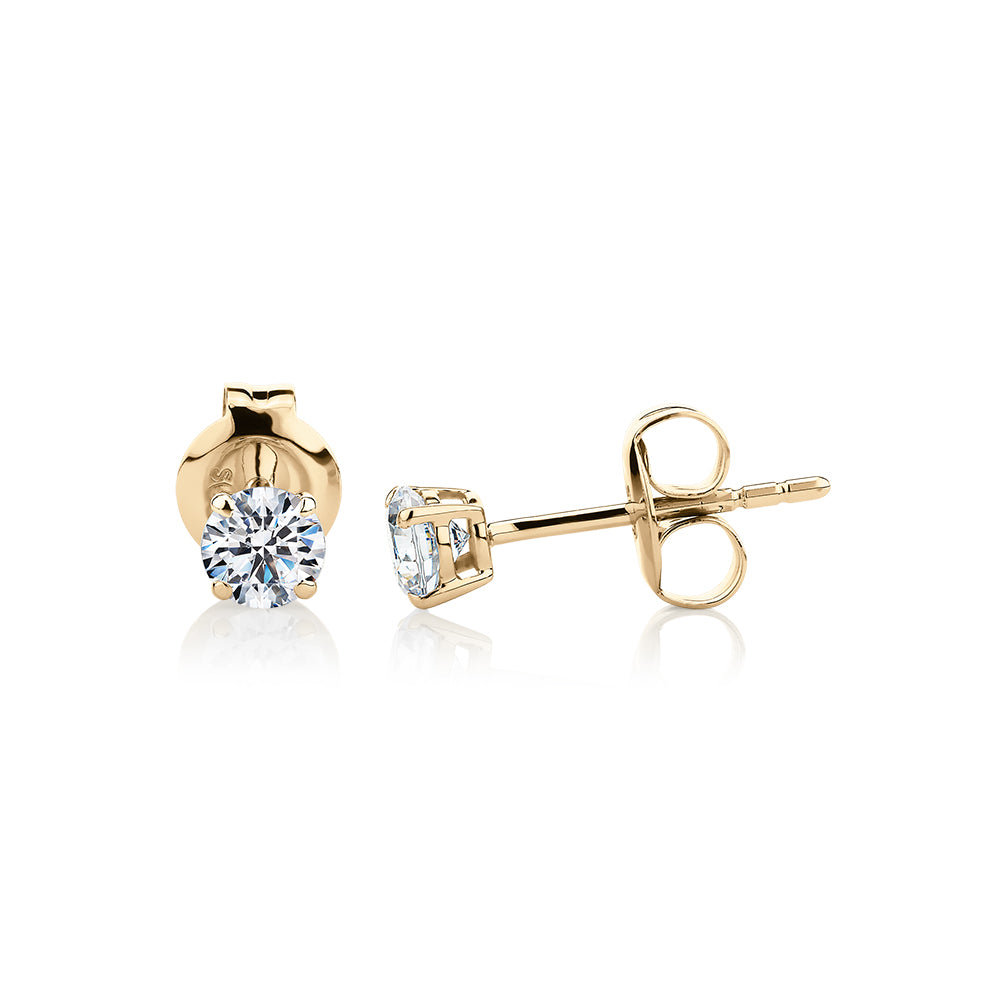Round Brilliant stud earrings with 0.5 carats* of diamond simulants in 10 carat yellow gold