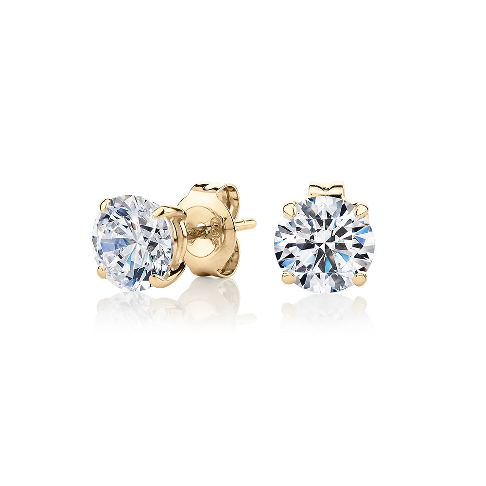 Round Brilliant stud earrings with 2 carats* of diamond simulants in 10 carat yellow gold