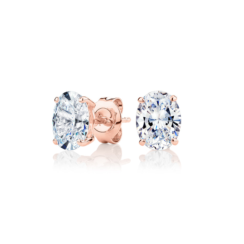 Oval stud earrings with 2 carats* of diamond simulants in 10 carat rose gold
