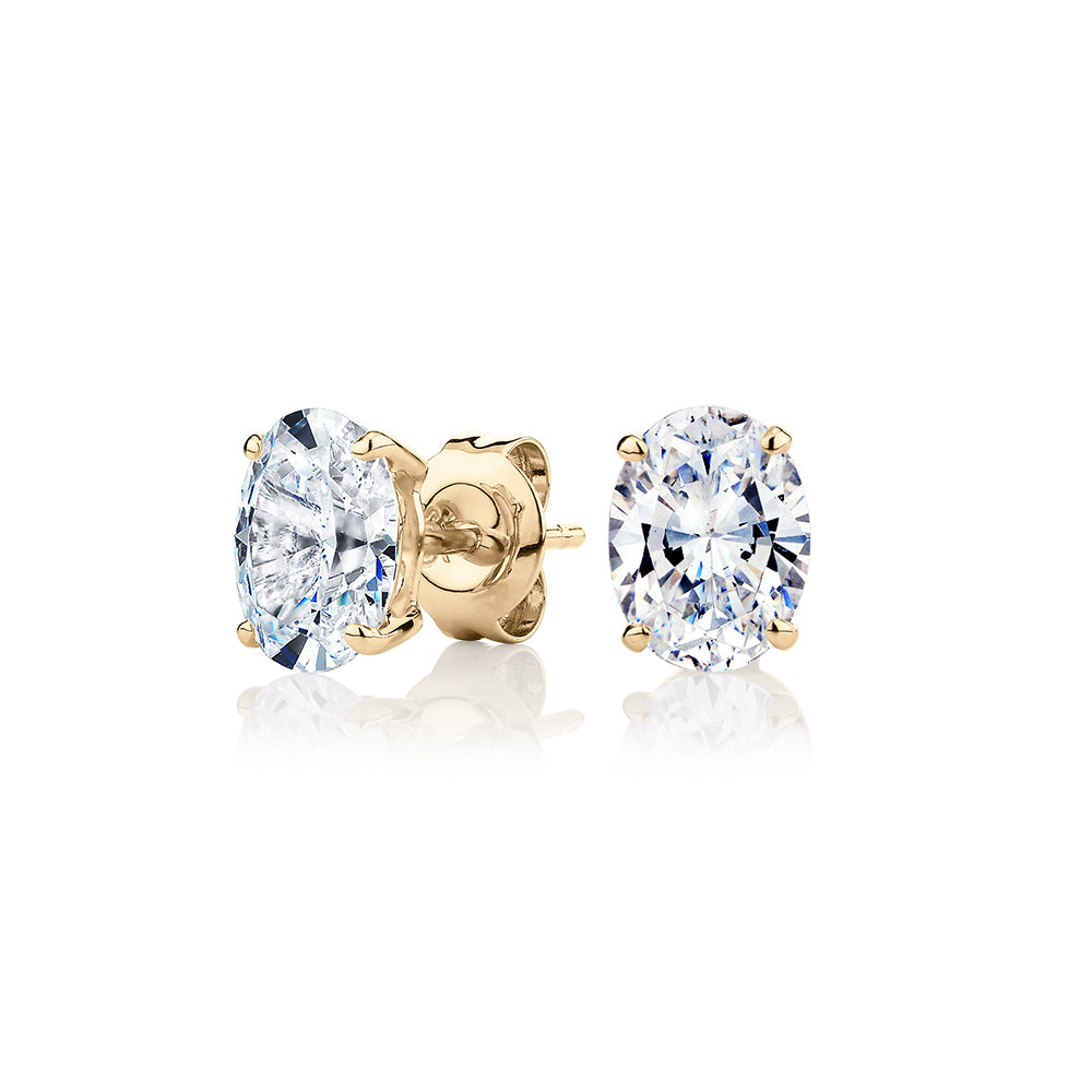 Oval stud earrings with 2 carats* of diamond simulants in 10 carat yellow gold