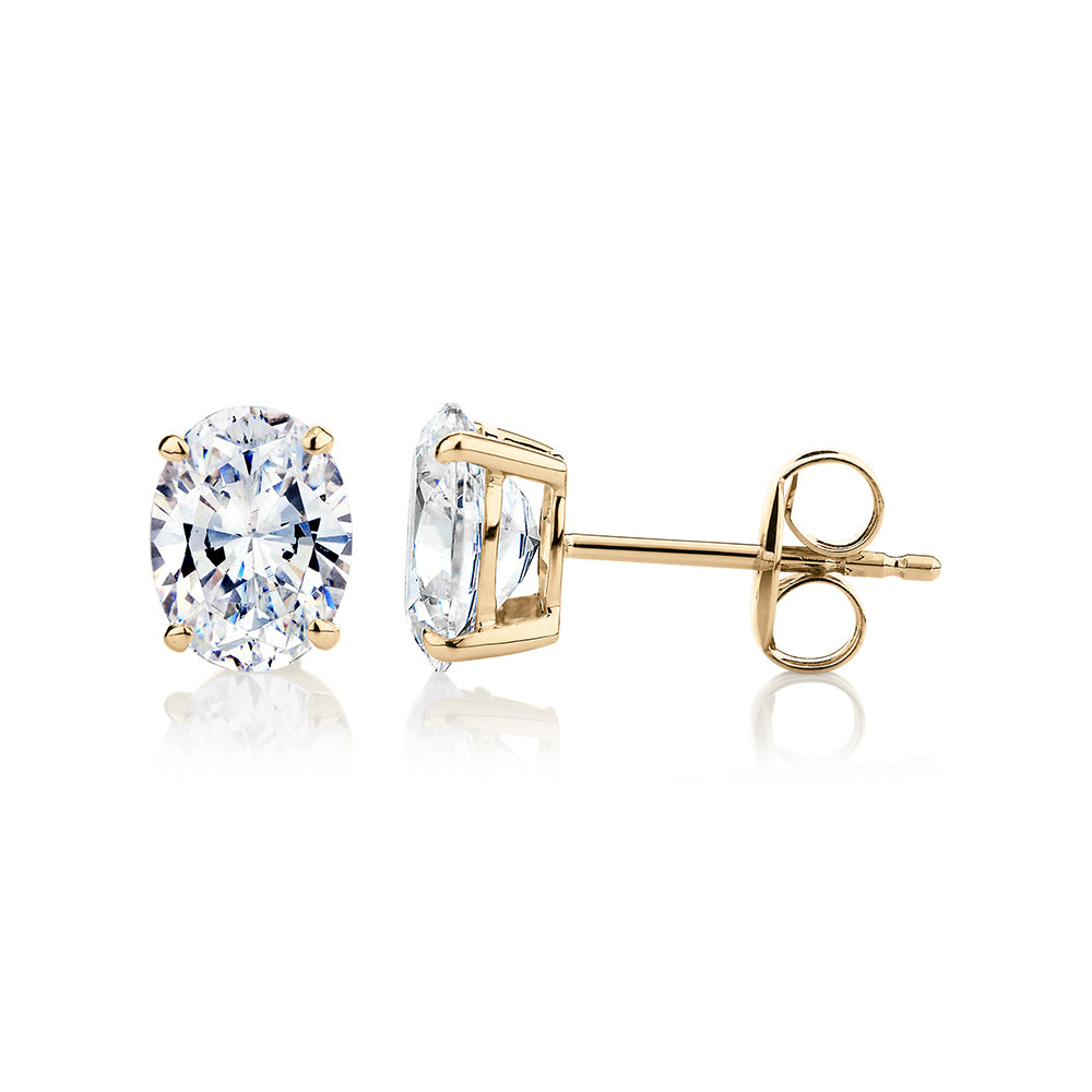 Oval stud earrings with 2 carats* of diamond simulants in 10 carat yellow gold