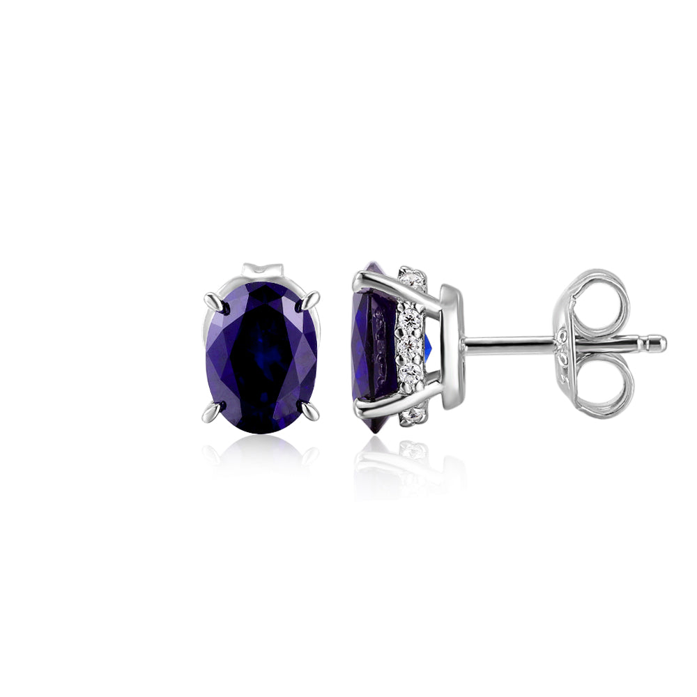 Oval stud earrings with dark blue sapphire simulants in sterling silver