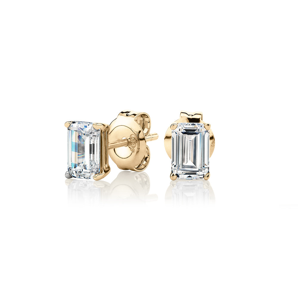Emerald Cut stud earrings with 1 carat* of diamond simulants in 10 carat yellow gold