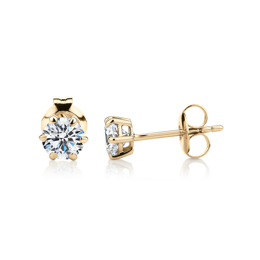 Round Brilliant stud earrings with 1 carat* of diamond simulants in 10 carat yellow gold