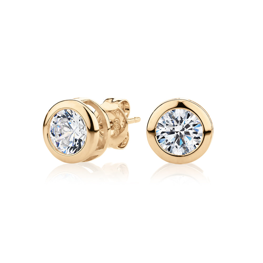 Round Brilliant stud earrings with 2 carats* of diamond simulants in 10 carat yellow gold