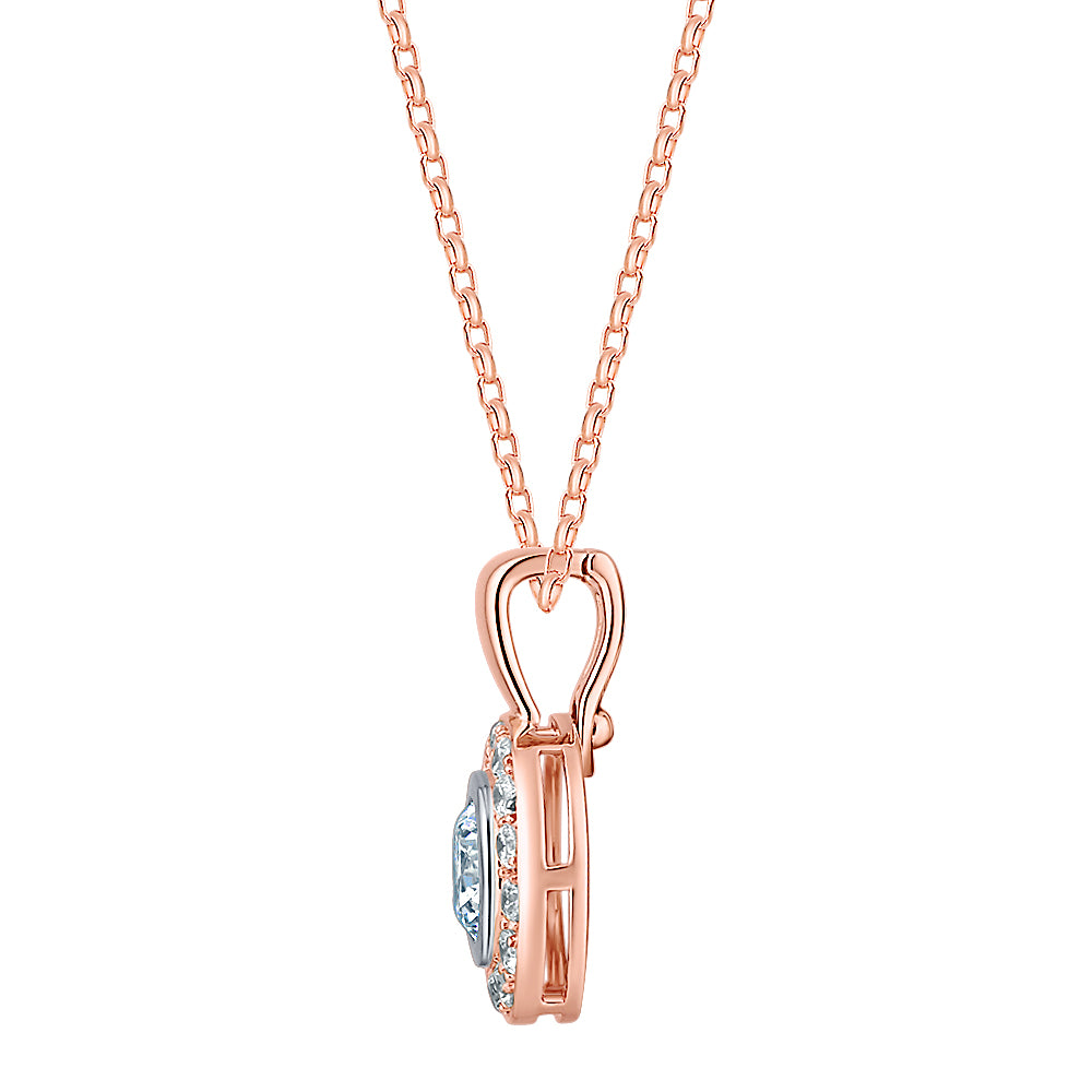 Halo pendant with 1.45 carats* of diamond simulants in 10 carat rose and white gold