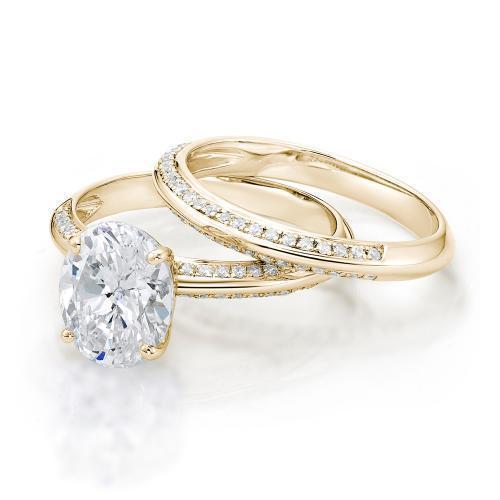 Oval Cut Knife Edge Engagement Ring and Band Set in Yellow Gold