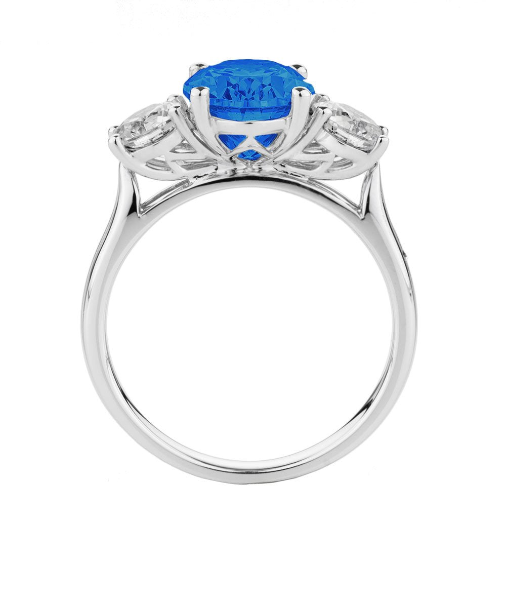 Three stone ring with 10x8mm ceylon sapphire simulant and 0.92 carats* of diamond simulants in 10 carat white gold