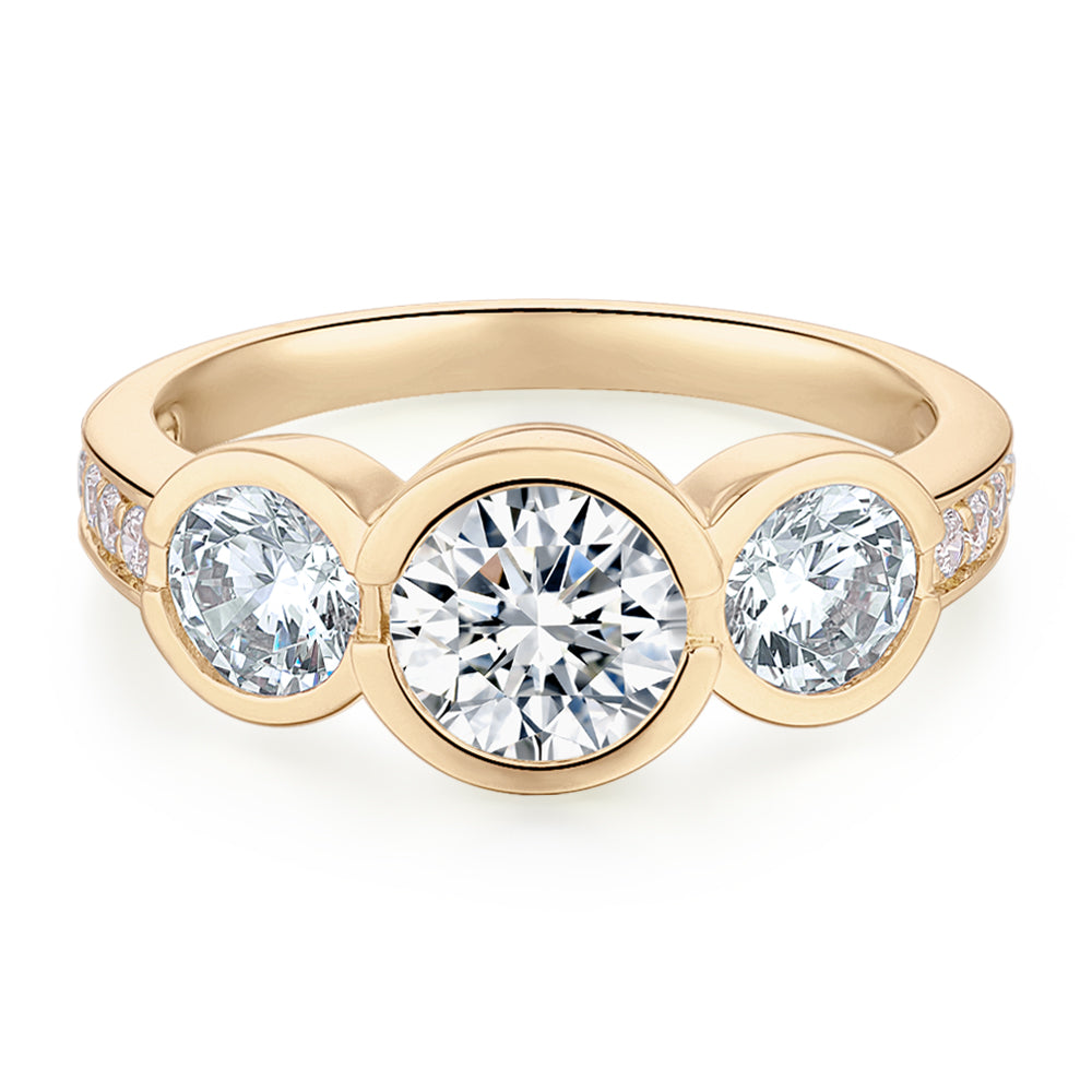 Three stone ring with 2.11 carats* of diamond simulants in 10 carat yellow gold