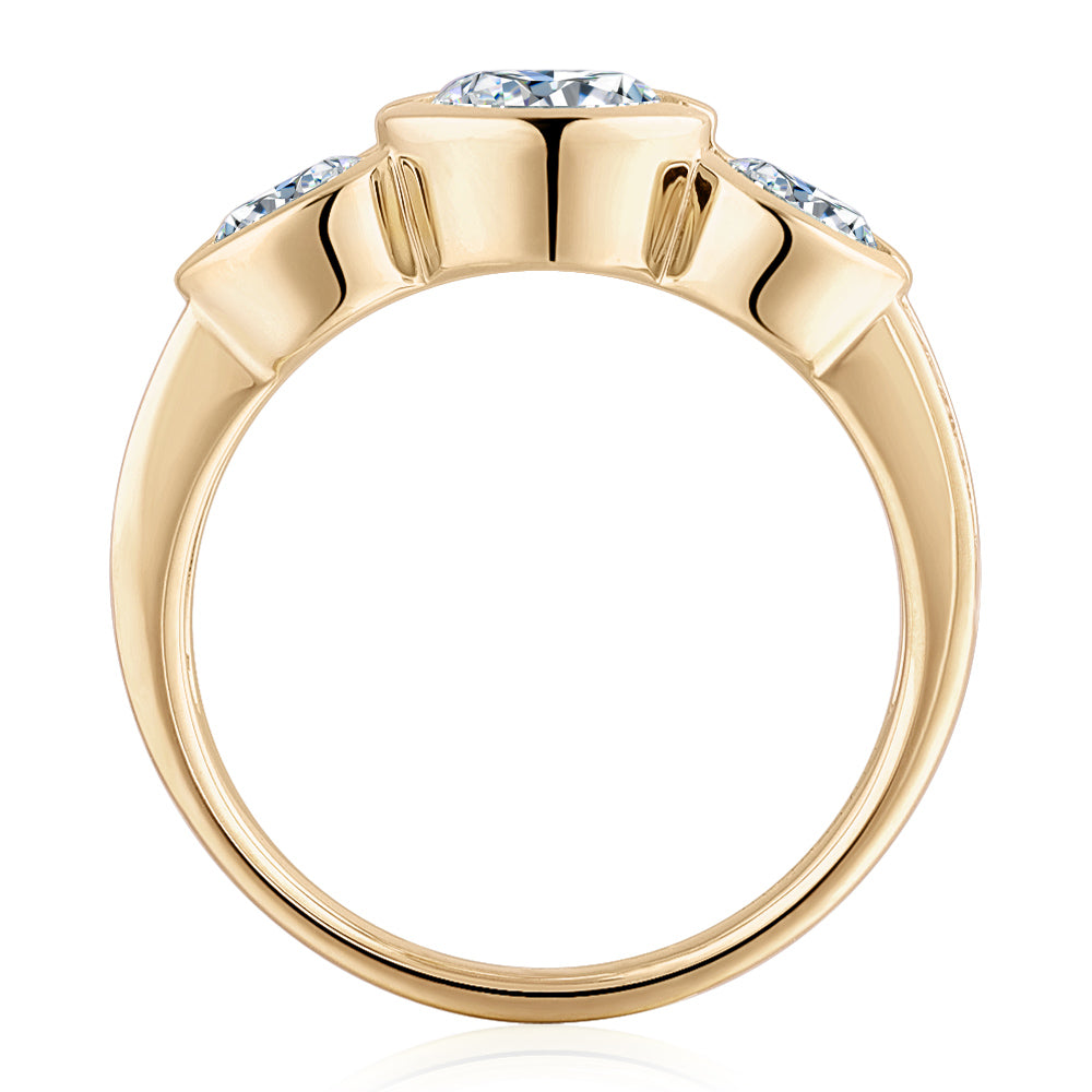 Three stone ring with 2.11 carats* of diamond simulants in 10 carat yellow gold
