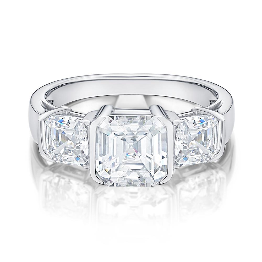 Three stone ring with 3.38 carats* of diamond simulants in 10 carat white gold