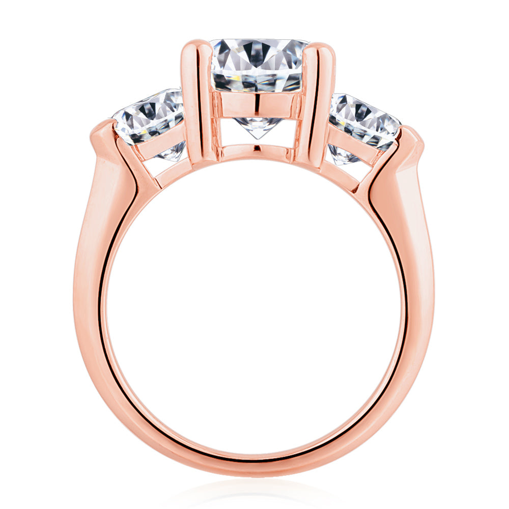 Three stone ring with 4.15 carats* of diamond simulants in 10 carat rose gold