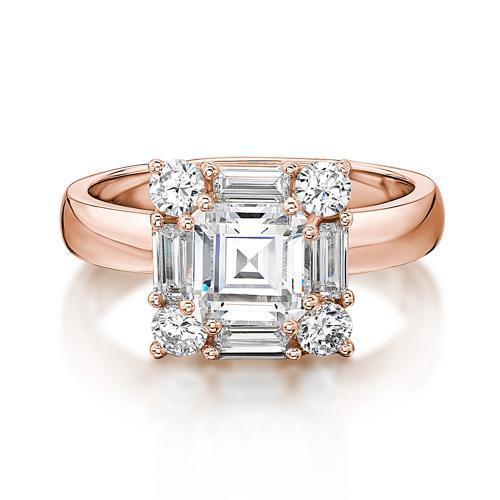 Princess Cut, Baguette and Round Brilliant halo engagement ring with 2.59 carats* of diamond simulants in 10 carat rose gold