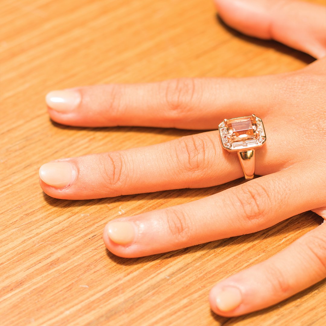 Emerald Cut, Baguette and Round Brilliant halo engagement ring with 4.53 carats* of diamond simulants in 10 carat rose gold