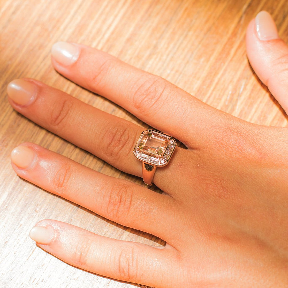 Emerald Cut, Baguette and Round Brilliant halo engagement ring with 4.53 carats* of diamond simulants in 10 carat rose gold