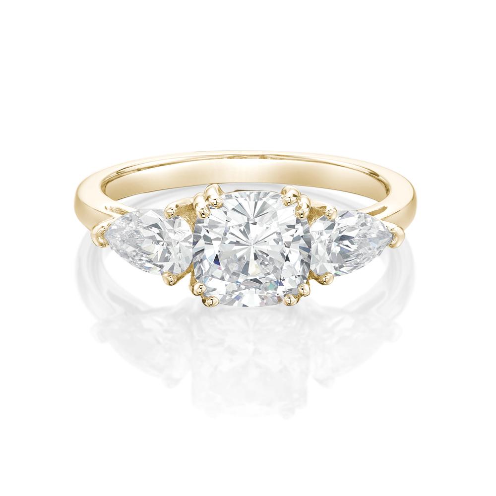 Three stone ring with 2.5 carats* of diamond simulants in 10 carat yellow gold